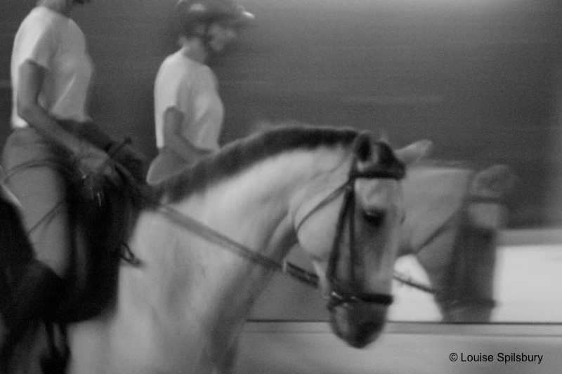 Riding lessons: Riding Gandalf, tension in rider's shoulder and arms, too much arch in her back which is also tension-related